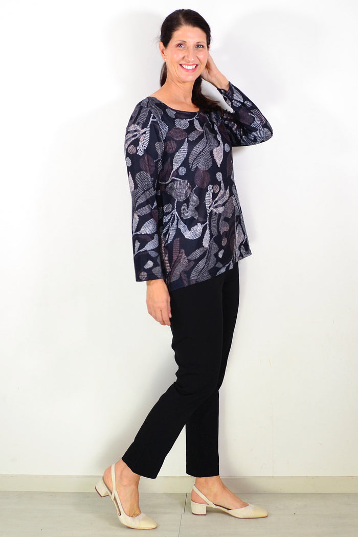 Black printed winter tunic top by Hourglass, featuring a stylish pattern and comfortable fit, ideal for casual winter wear.