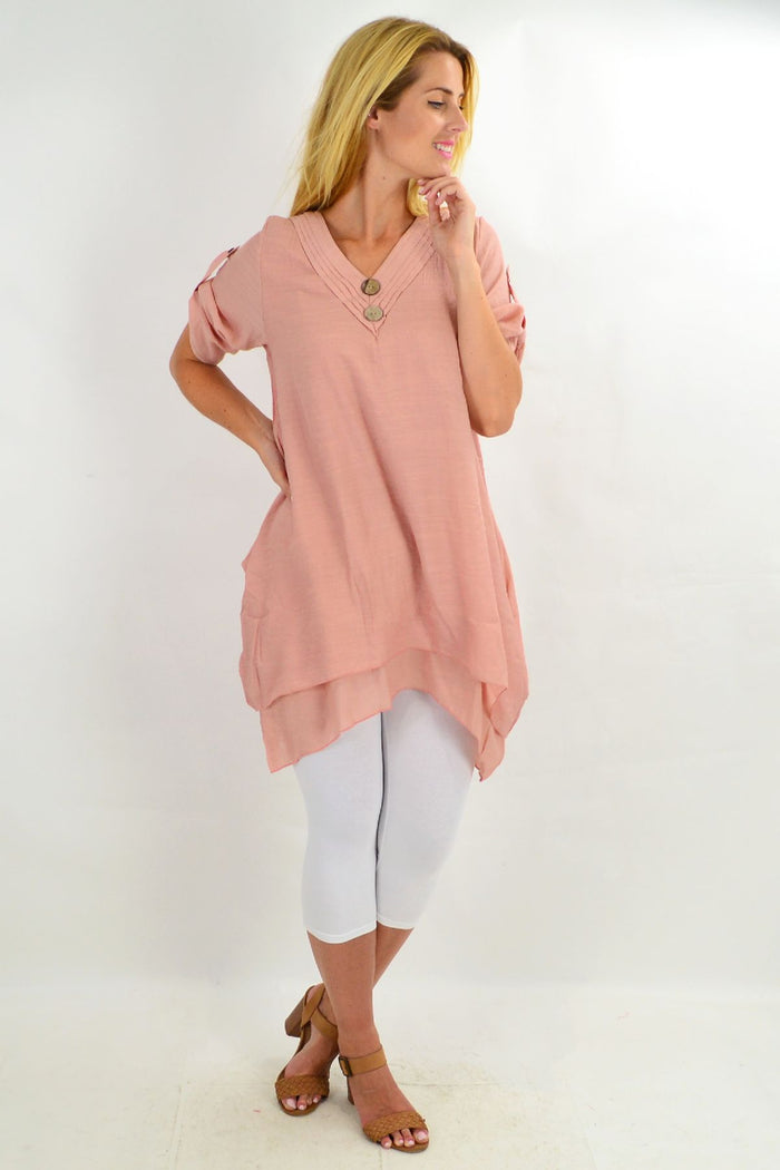 Blush coconut button short sleeve tunic top by La Mode, featuring a relaxed fit and stylish front buttons.