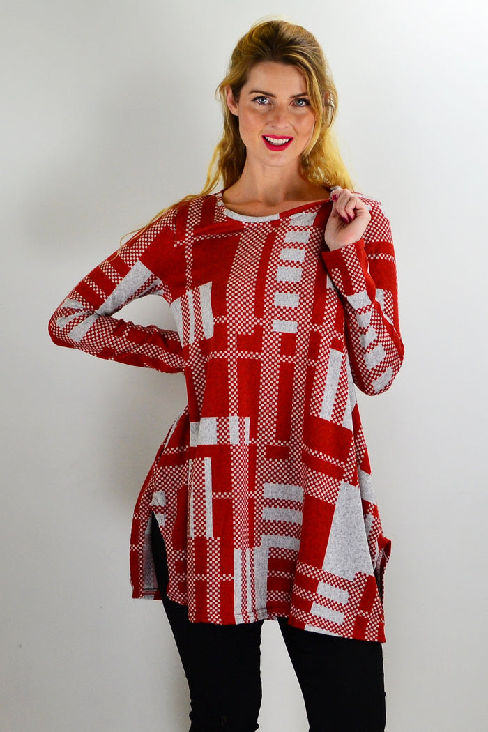 Rust grey knit tunic top from Hourglass, featuring a cozy, textured knit fabric and relaxed fit, displayed on a hanger.