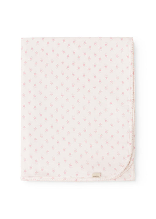 Square mini rug in offwhite with pink floral print and rounded edge.