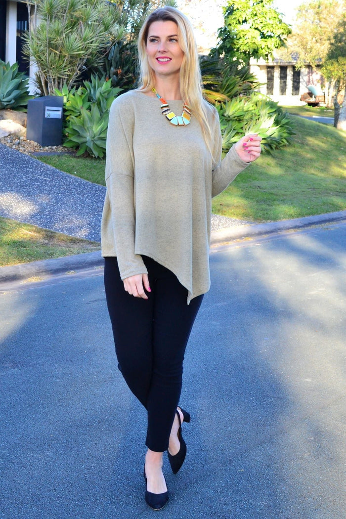 Green drop shoulder tunic top by Peony featuring a relaxed fit and stylish angle design, displayed on a mannequin.