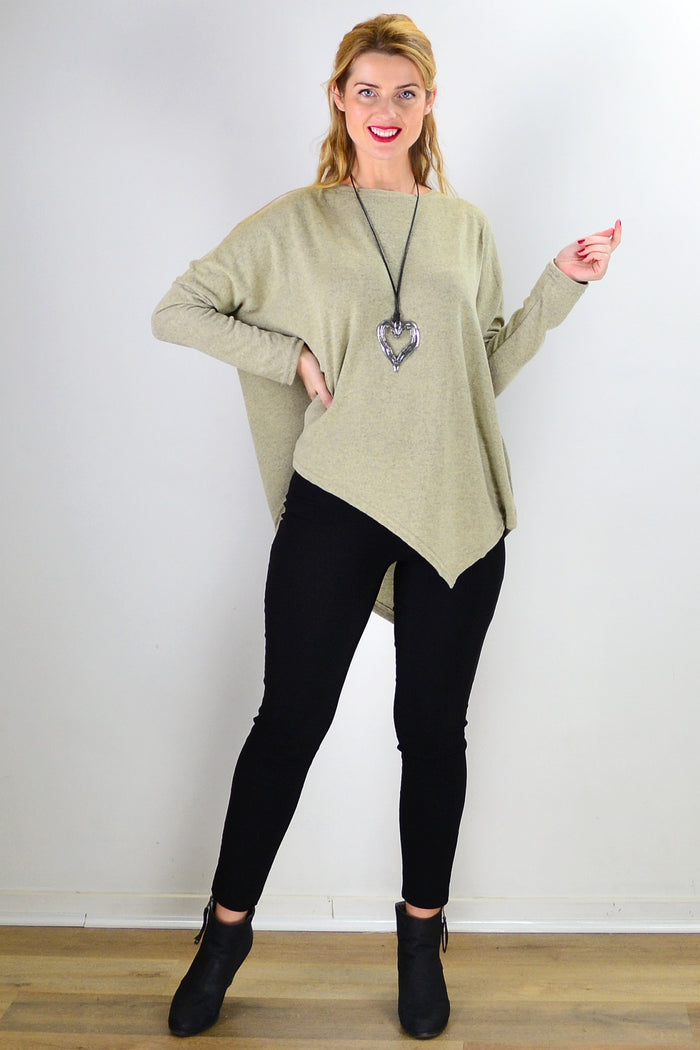 Green drop shoulder tunic top by Peony with a relaxed fit and angled hem, displayed on a hanger against a plain background.