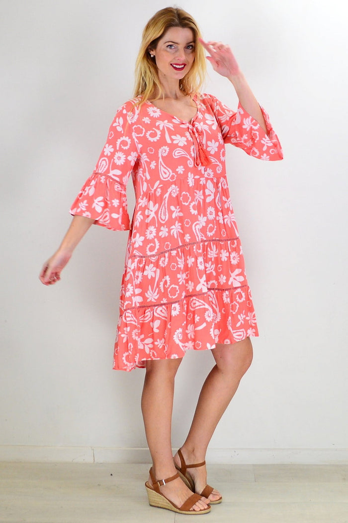 Apricot white bohemian tunic dress by New U Collection with flowy fabric and relaxed fit, displayed on a hanger.