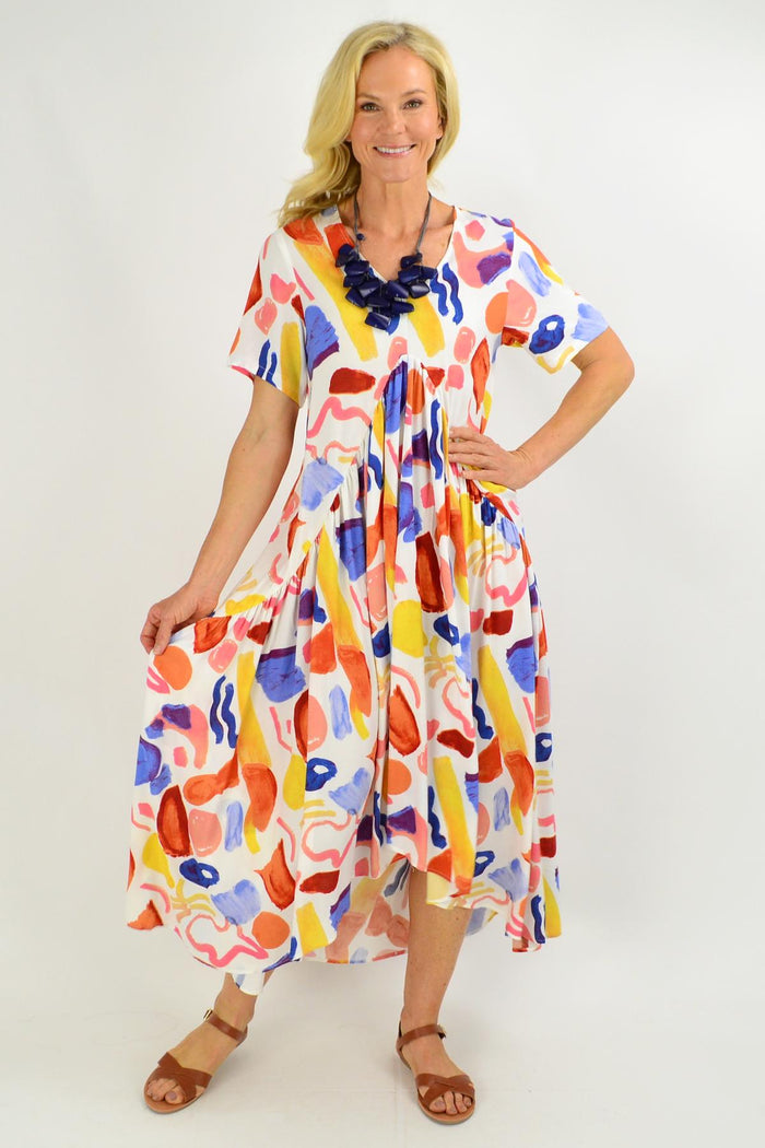 Long artist-style maxi tunic dress from New U Collection with a flowing silhouette and vibrant pattern.