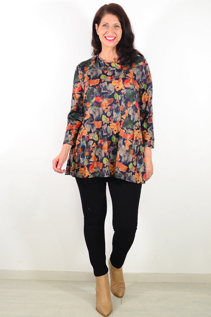 Wishstone Autumn Leaves ladies tunic top featuring a floral print and relaxed fit, displayed on a hanger.