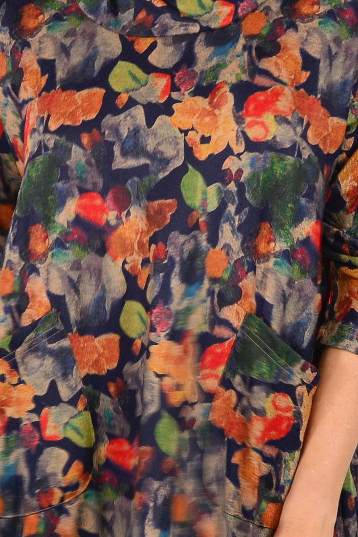 Wishstone Autumn Leaves Ladies Tunic Top featuring a vibrant leaf pattern and relaxed fit, displayed on a hanger.