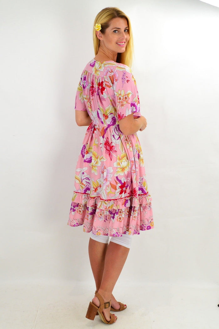 Pink girly girl tunic dress by New U Collection, featuring a soft fabric and feminine style, displayed on a hanger.