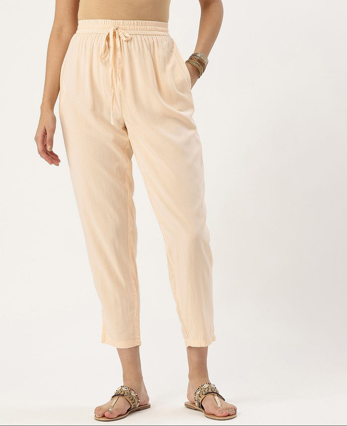 Beige pants worn by a person on a white background, Beige Solid Pencil Pant, Solid pencil Pant, plain pant