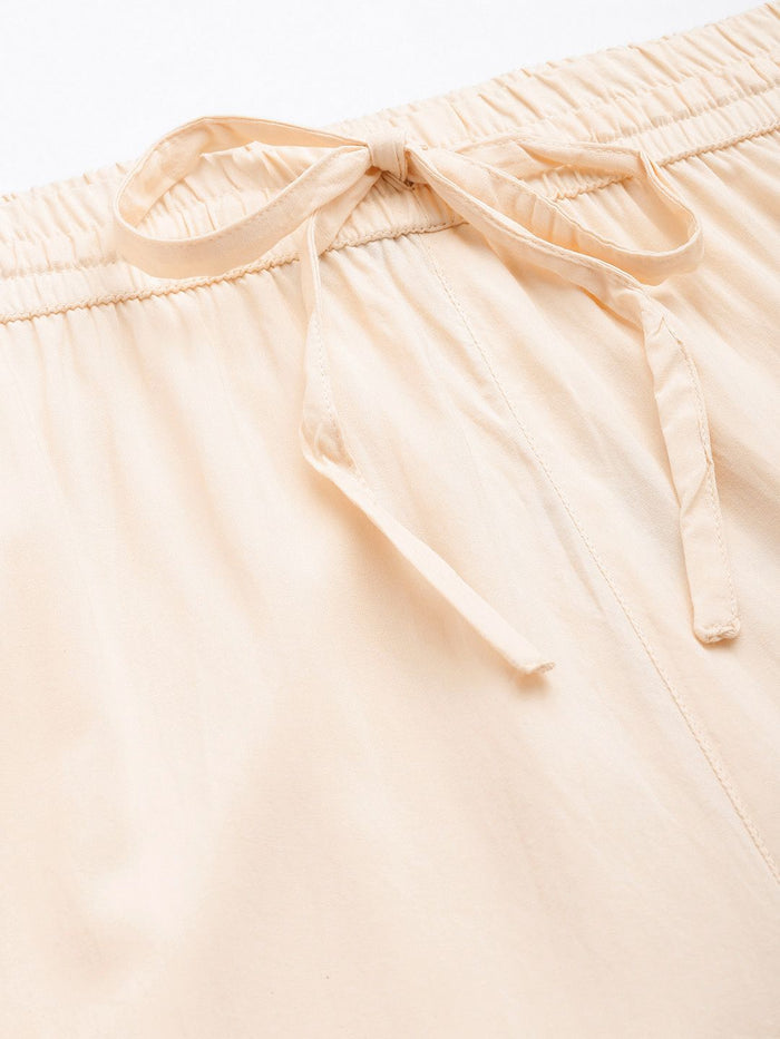 Beige pants worn by a person on a white background, Beige Solid Pencil Pant, Solid pencil Pant, plain pant