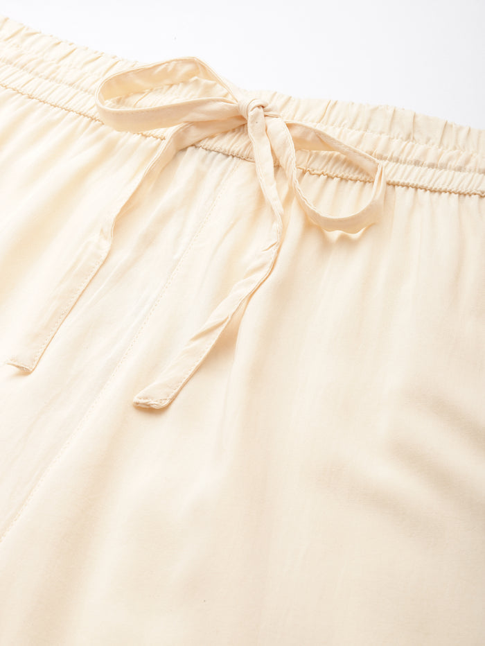 Beige pants worn by a person on a white background, Beige Solid Pencil Pant, Solid pencil Pant, plain pant