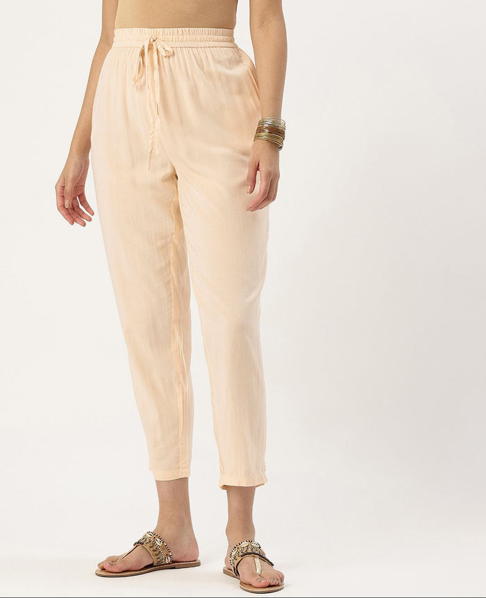 Beige pants worn by a person on a white background, Beige Solid Pencil Pant, Solid pencil Pant, plain pant