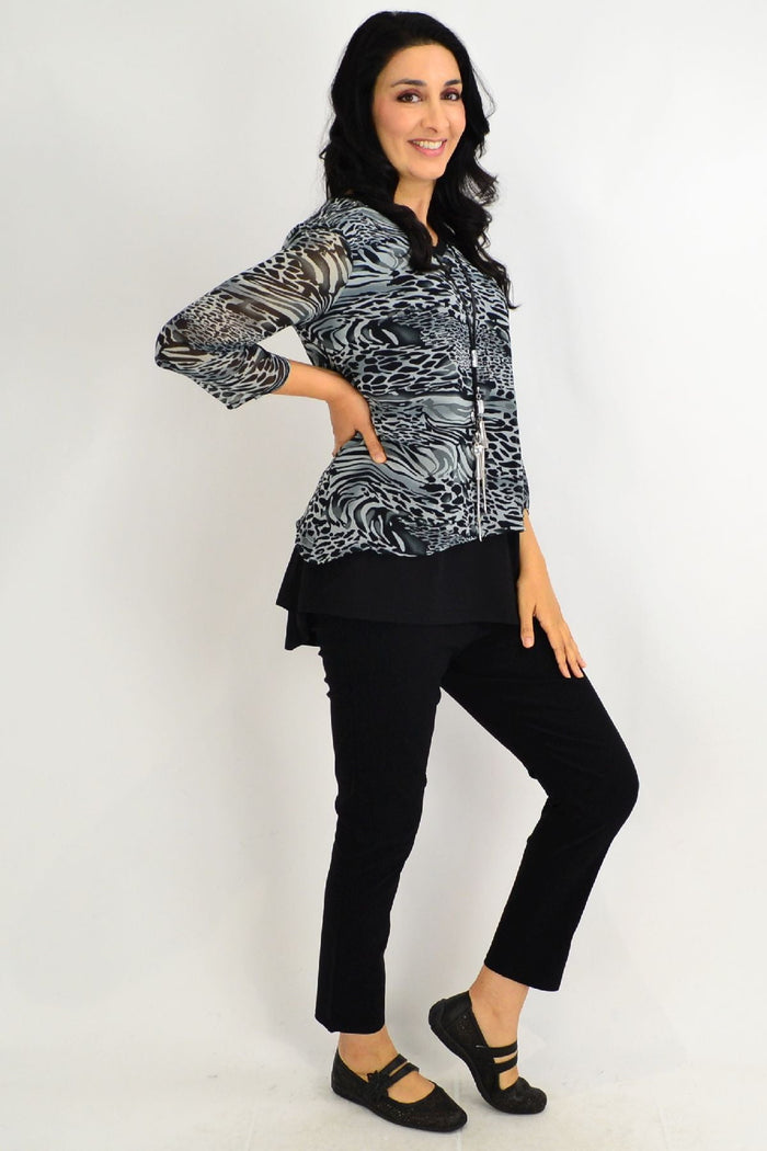 Black Annie Animal Print Tunic Top by Stylius, featuring a stylish animal print design and relaxed fit, shown on a model.