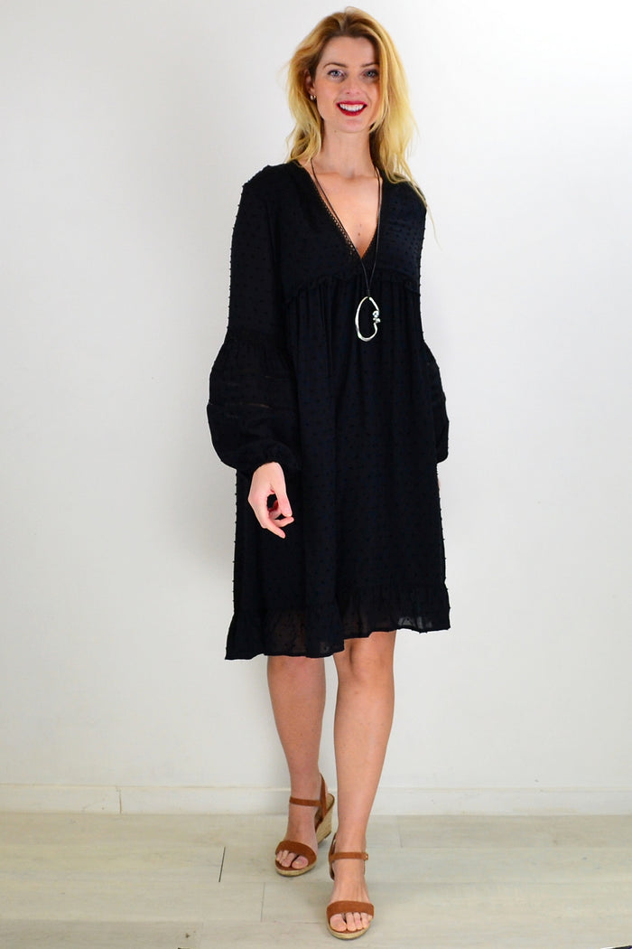 Black bohemian tunic dress by New U Collection, featuring flowing fabric and relaxed fit, shown on a model.