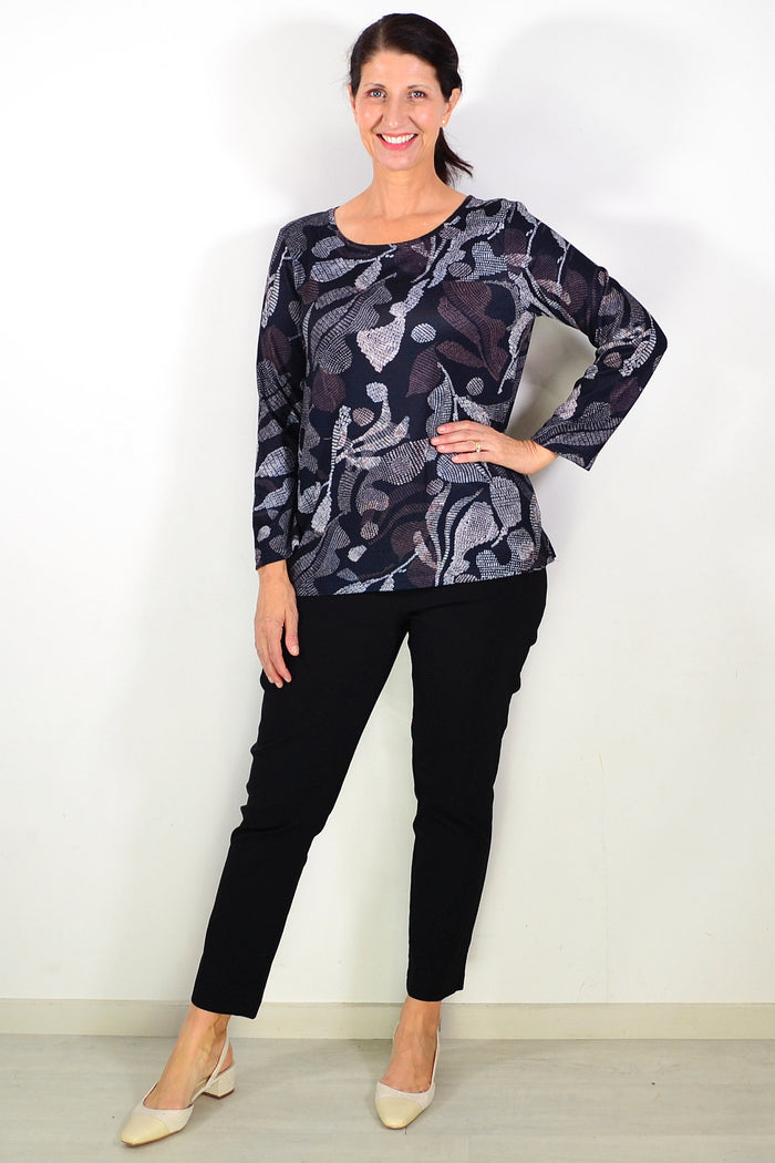 Black printed winter tunic top by Hourglass featuring a stylish pattern, long sleeves, and a comfortable fit for cold weather.