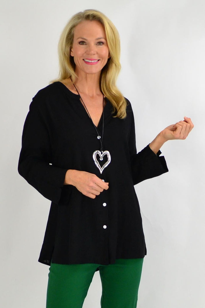 Black linen V-neck tunic shirt for women by Ruby Rain, featuring a relaxed fit and lightweight cotton linen fabric.
