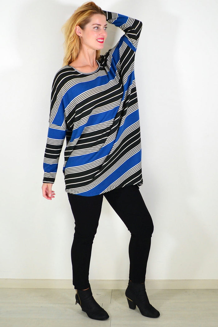 Blue and black La Mode Walk My Way fleece tunic top, casual style with a relaxed fit and soft fabric, displayed on a hanger.