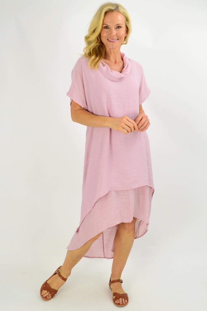 Blush pink cowl neck tunic dress by Cotton Village, featuring a relaxed fit and soft fabric, displayed on a hanger.