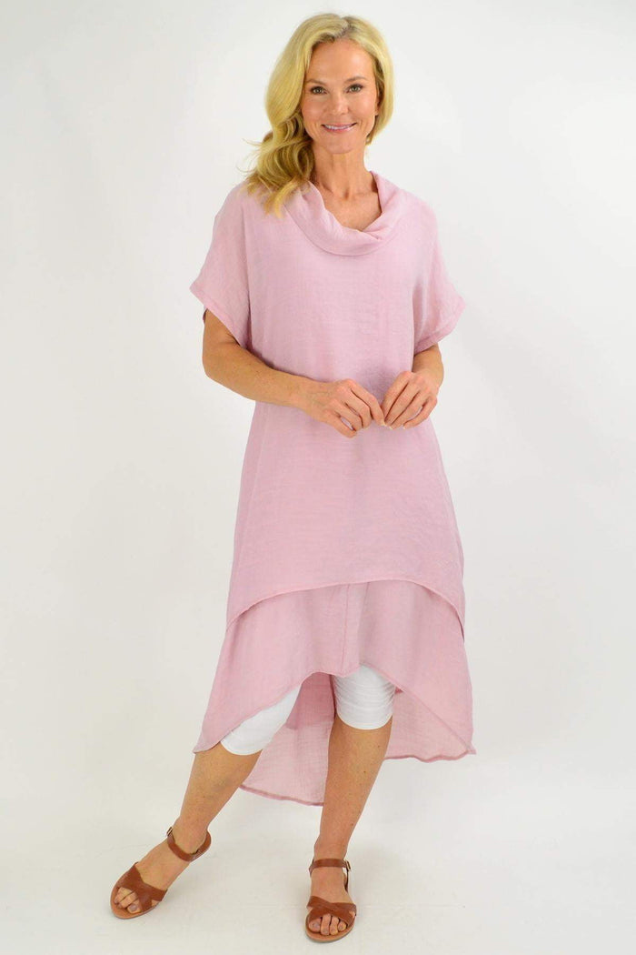 Dusty pink Cotton Village cowl neck tunic dress with relaxed fit, soft fabric, and long sleeves, styled for casual wear.