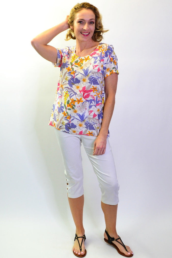 Stylius Botanical Garden Tunic Blouse featuring floral print, lightweight fabric, and relaxed fit, displayed on a mannequin.