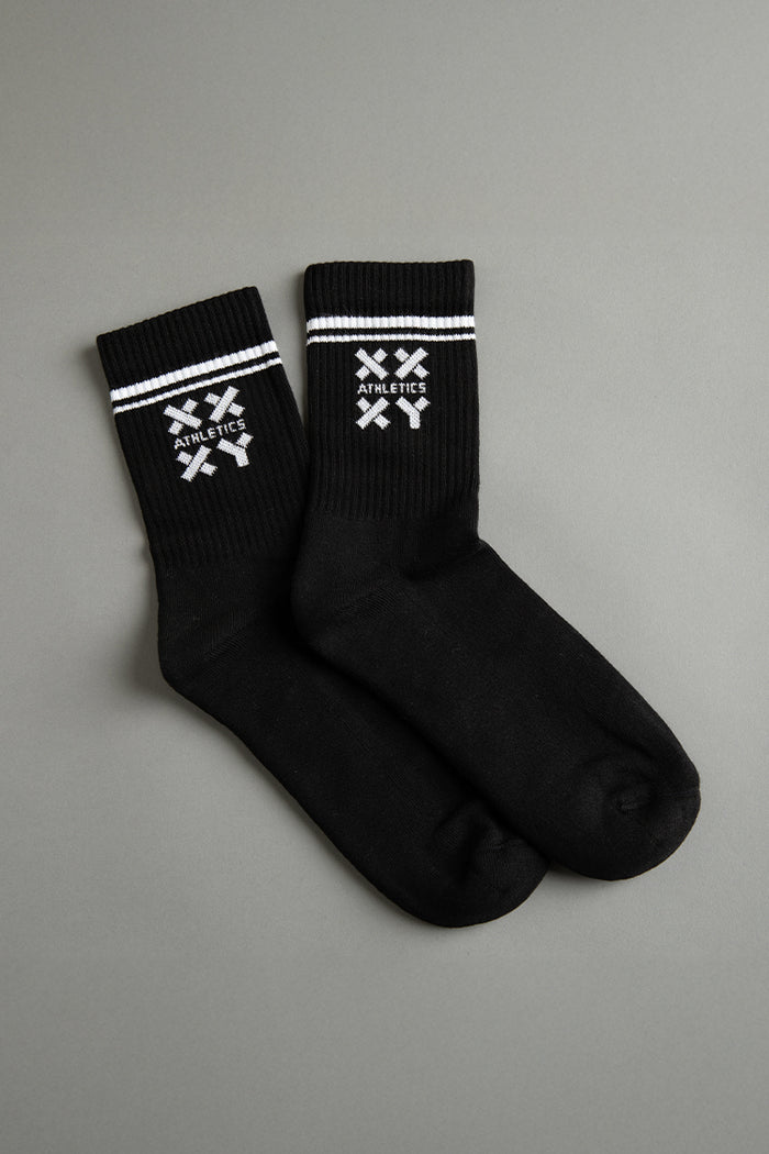 Black socks with white logo on a gray background || black
