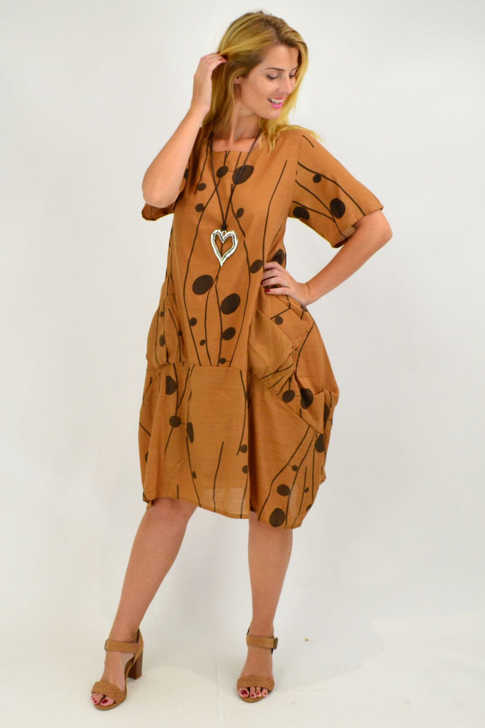 Caramel Dots Bubble Tunic Dress by La Mode, featuring a playful bubble design and relaxed fit, displayed on a hanger.