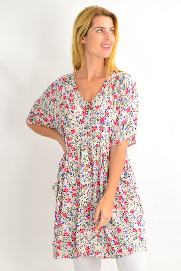 Cream coconut button pocket tunic dress by Silver Wishes, featuring a relaxed fit, short sleeves, and front button details.