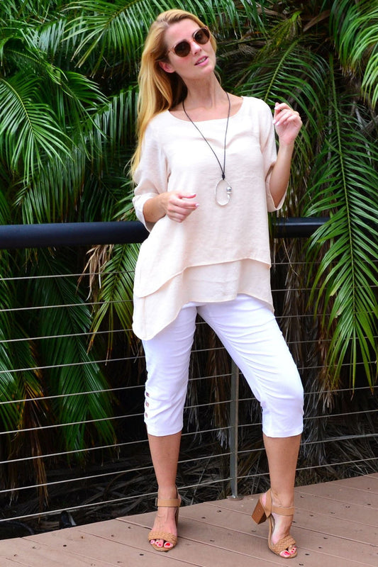Cream layered weekend tunic blouse by La Mode, featuring a relaxed fit and stylish design, displayed on a hanger.