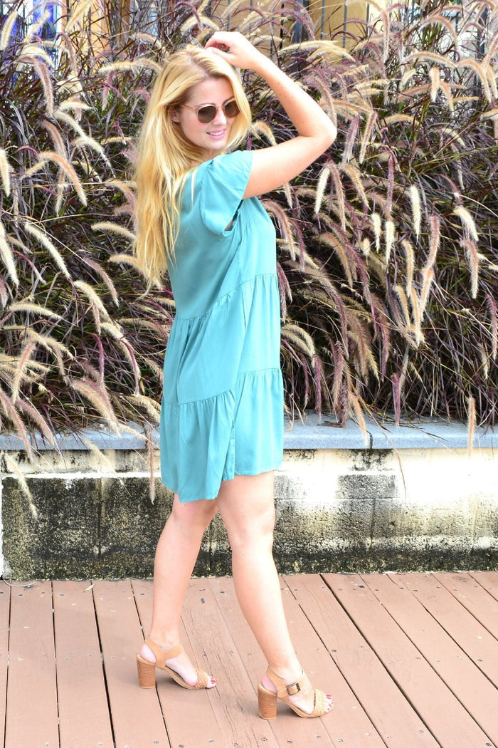 Dark green copper tiered tunic dress by I Love Tunics, featuring layered fabric and a flowing silhouette.