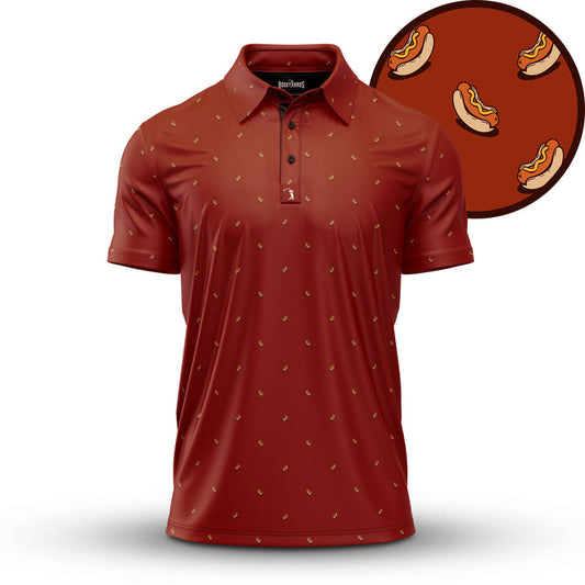 The Doggy Dog - Polo is a maroon athletic-fit shirt with moisture-wicking fabric, shown on a white background. It features a playful repeating hot dog print and includes an inset close-up of the fun food motif.
