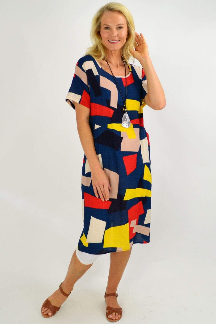 Blue and yellow geometric shape tunic dress by Wishstone, featuring a long, flowing design and modern pattern.