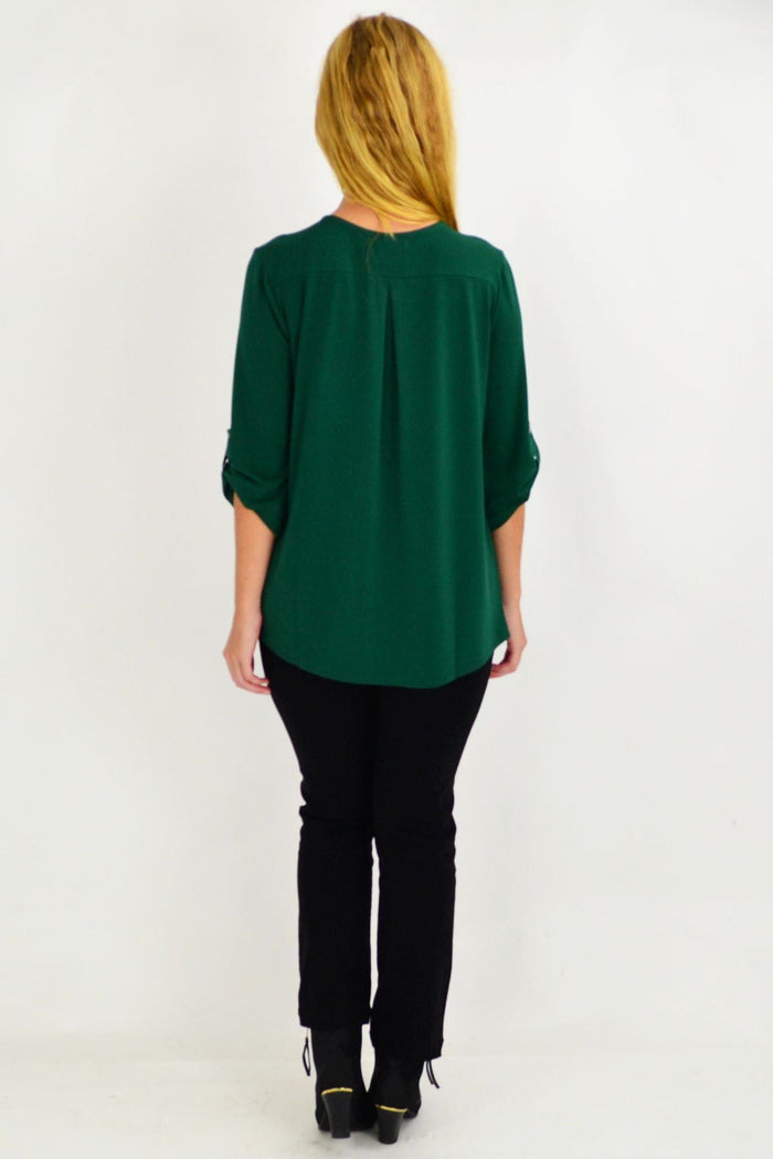 Green Amelia tunic by Envogo featuring a relaxed fit, long sleeves, and a flowy, comfortable design perfect for casual wear.