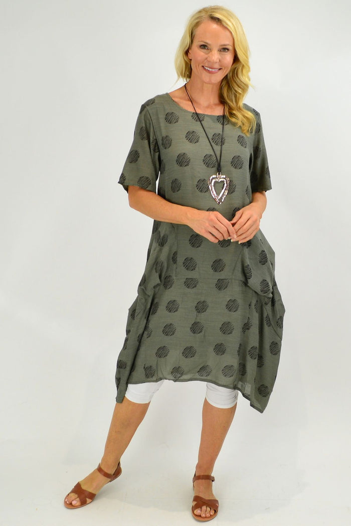Grey bubble tunic dress by La Mode featuring a relaxed fit and soft fabric, shown hanging on a wooden hanger.