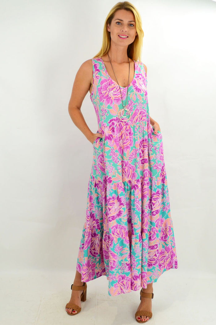 Hibiscus tiered long tunic maxi dress by New U Collection, featuring flowing fabric, floral pattern, and layered design.