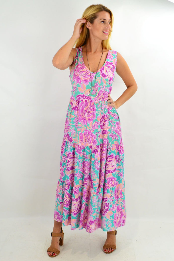 Hibiscus print tiered long tunic maxi dress by New U Collection, featuring flowy fabric and tiered design with vibrant floral pattern.