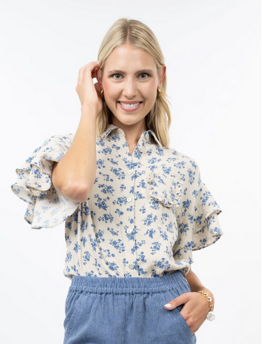 cream top with blue floral and ruffle sleeves