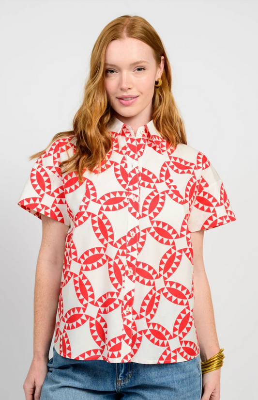 red and white geometric pattern top