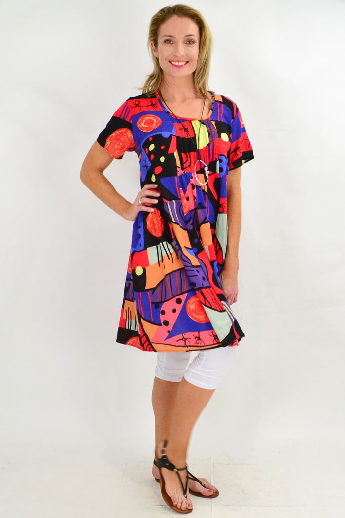 Hourglass Ken Done inspired peasant tunic dress with vibrant floral patterns, flowing fabric, and relaxed fit.