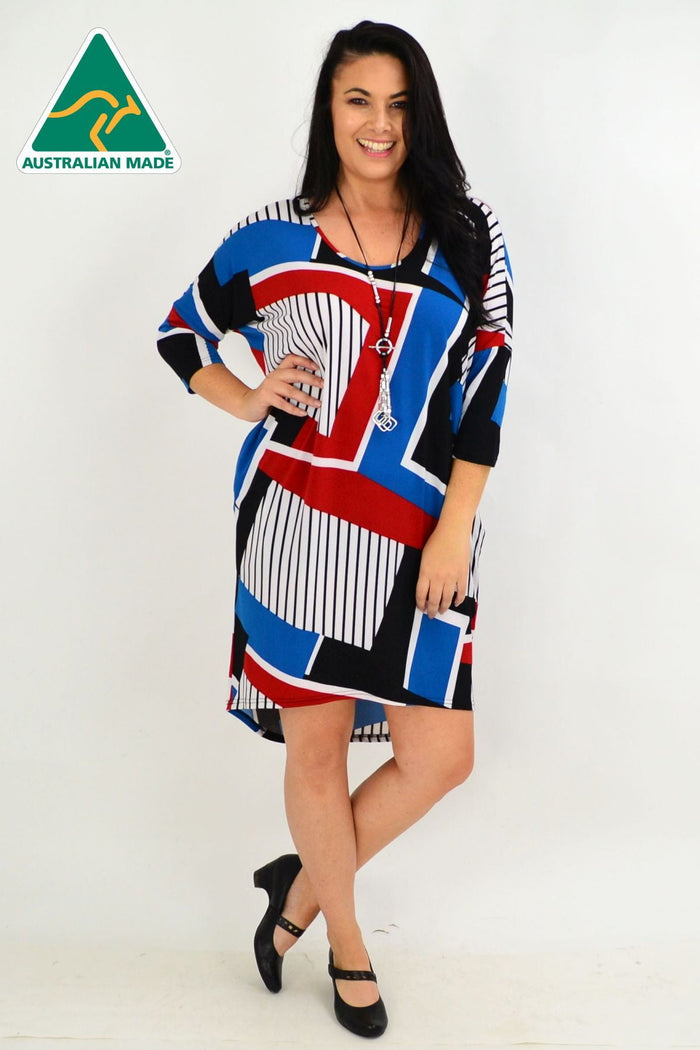 Four Girlz Lines & Stripes hi-low tunic dress with vertical and horizontal stripe patterns, flowing fabric and casual style.