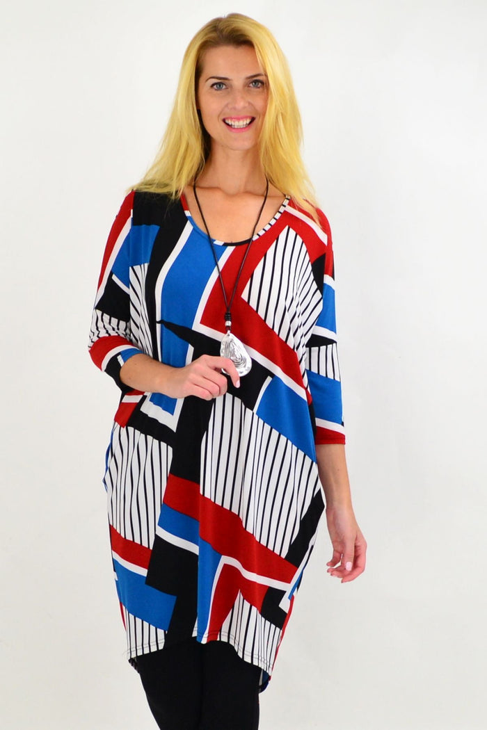 Four Girlz Lines & Stripes Hi Low Tunic Dress with bold horizontal and vertical stripe patterns, lightweight and flowy fabric.