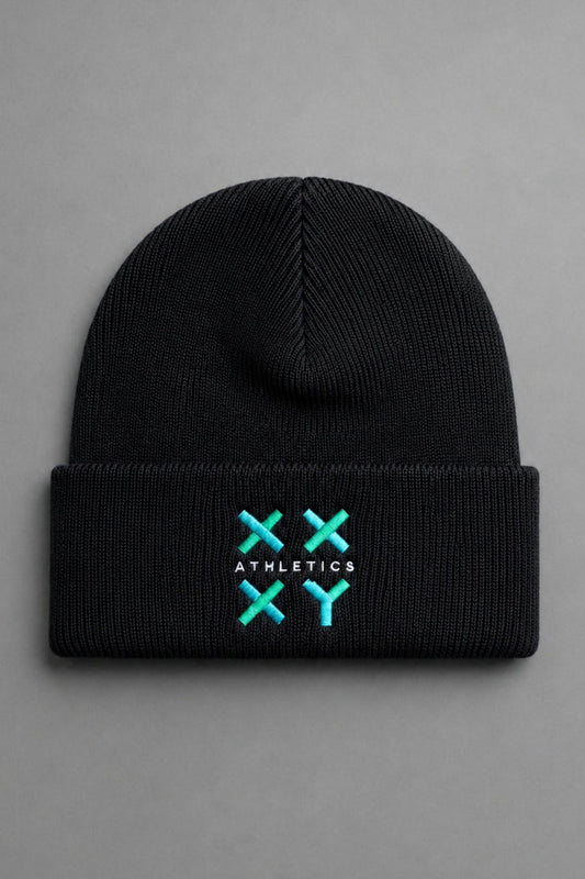 A black ribbed knit beanie hat with a folded cuff, featuring a turquoise and white embroidered logo on the front that reads 'ATHLETICS' with crossed 'X' symbols. The beanie is photographed flat against a neutral gray background. || Black