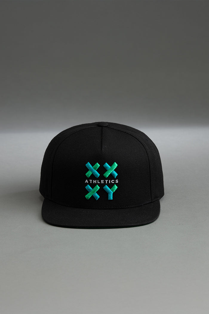 Black cap with green and white logo on a gray background || black
