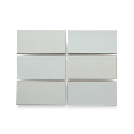 Six Heath Ceramics ceramic tiles glazed in Winter Sky, a matte pale blue/grey glaze