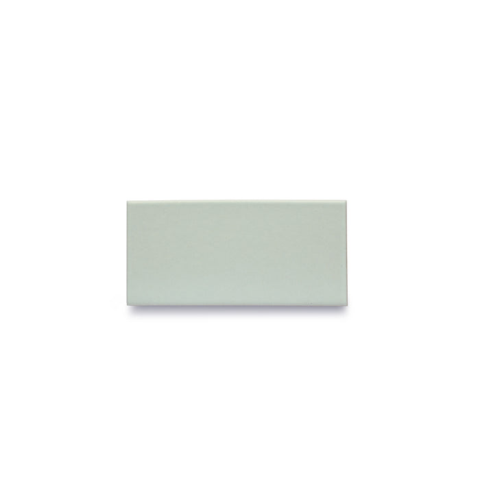 One Heath Ceramics ceramic tile glazed in Winter Sky, a matte pale blue/grey glaze