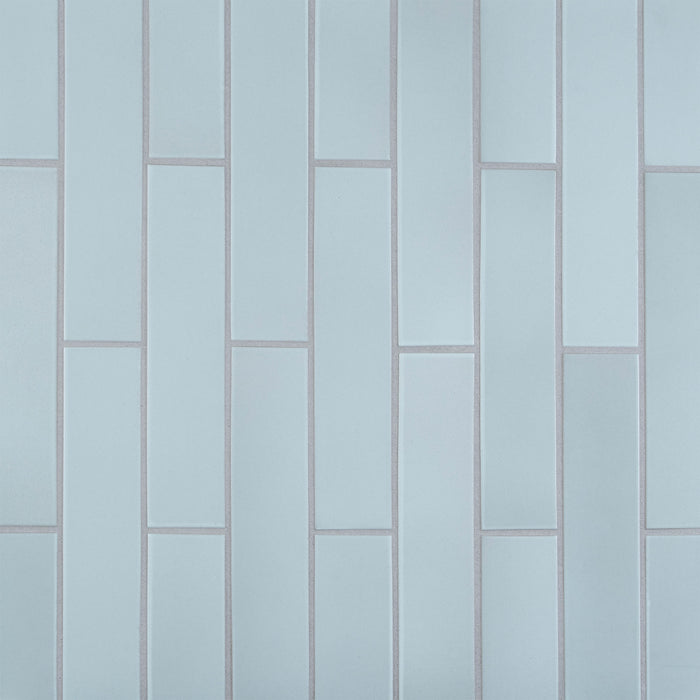 Caption: Classic Field 2x9 M123 Winter Sky. Delorean Grey grout by Custom Building Products.