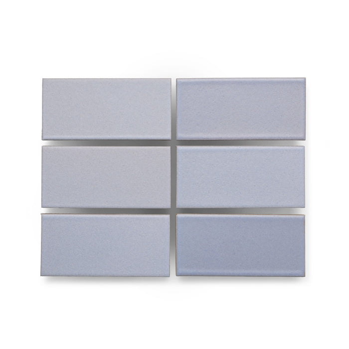 Six Heath Ceramics Ceramic Tiles glazed in Blue Thistle, a pale periwinkle color.