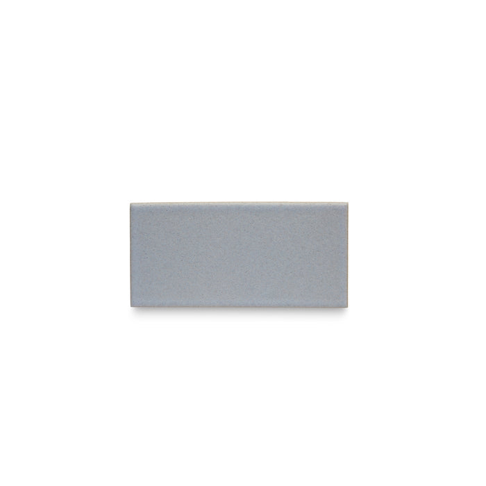 One Heath Ceramics Ceramic Tiles glazed in Blue Thistle, a pale periwinkle color.