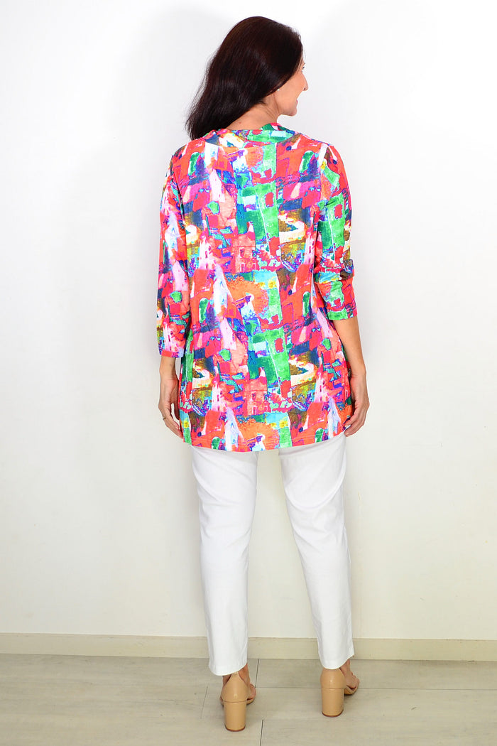 Multicolour abstract print Wishstone tunic top with long sleeves and relaxed fit, displayed on a hanger.