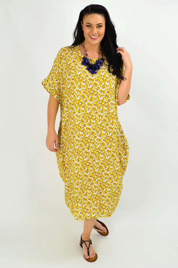 Mustard tiny floral tunic dress by La Bay featuring a relaxed fit and delicate floral pattern, displayed on a hanger.