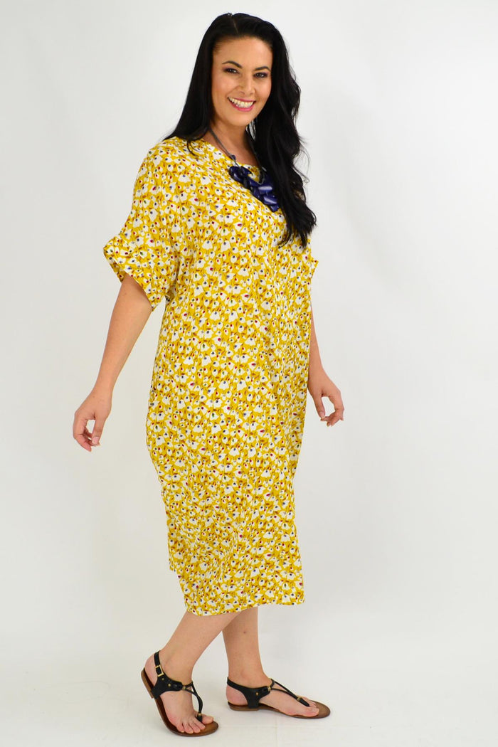 Mustard tiny floral tunic dress by La Bay featuring a relaxed fit and delicate floral pattern on lightweight fabric.