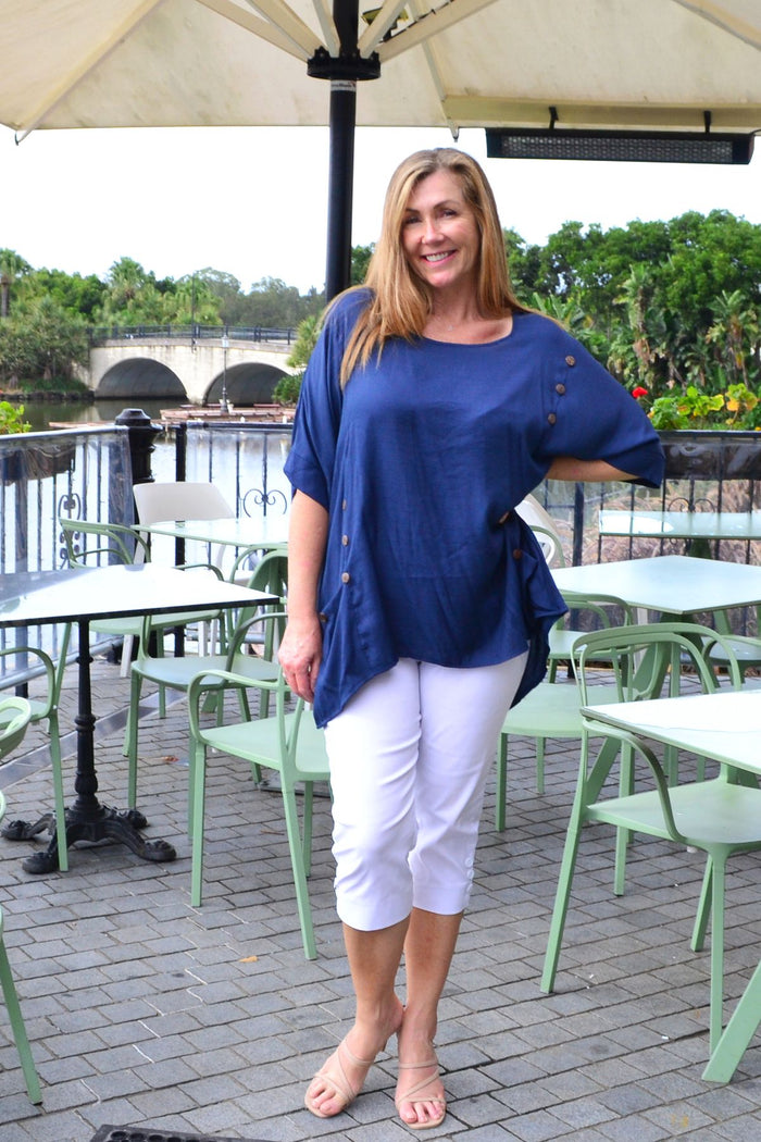 Navy blue coconut button sloping sleeve tunic top by Wishstone, featuring a loose fit and stylish design, displayed on a hanger.